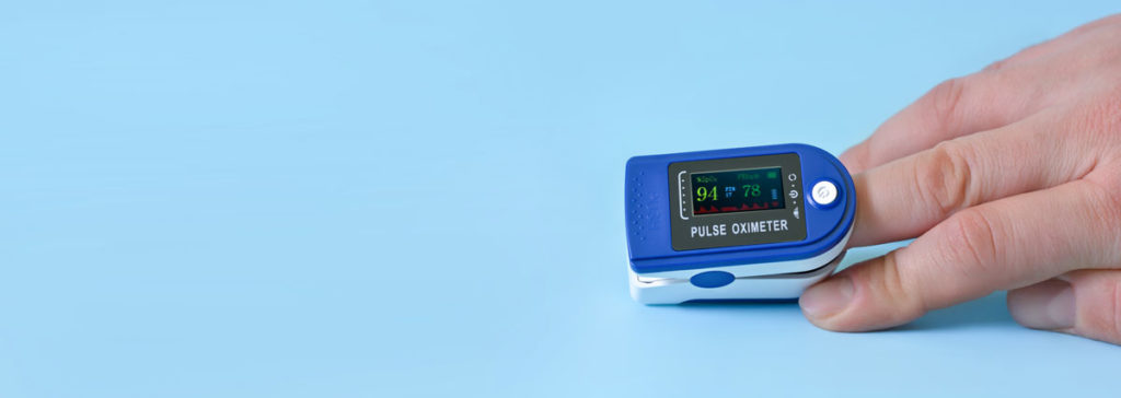 Pulse Oximeter On A Dental Patient's Finger