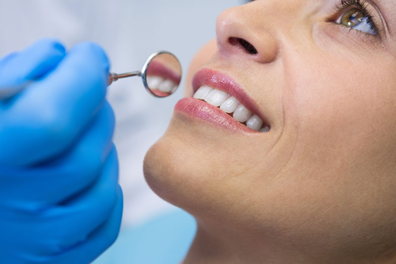 Dental Patient Smiling During A Procedure